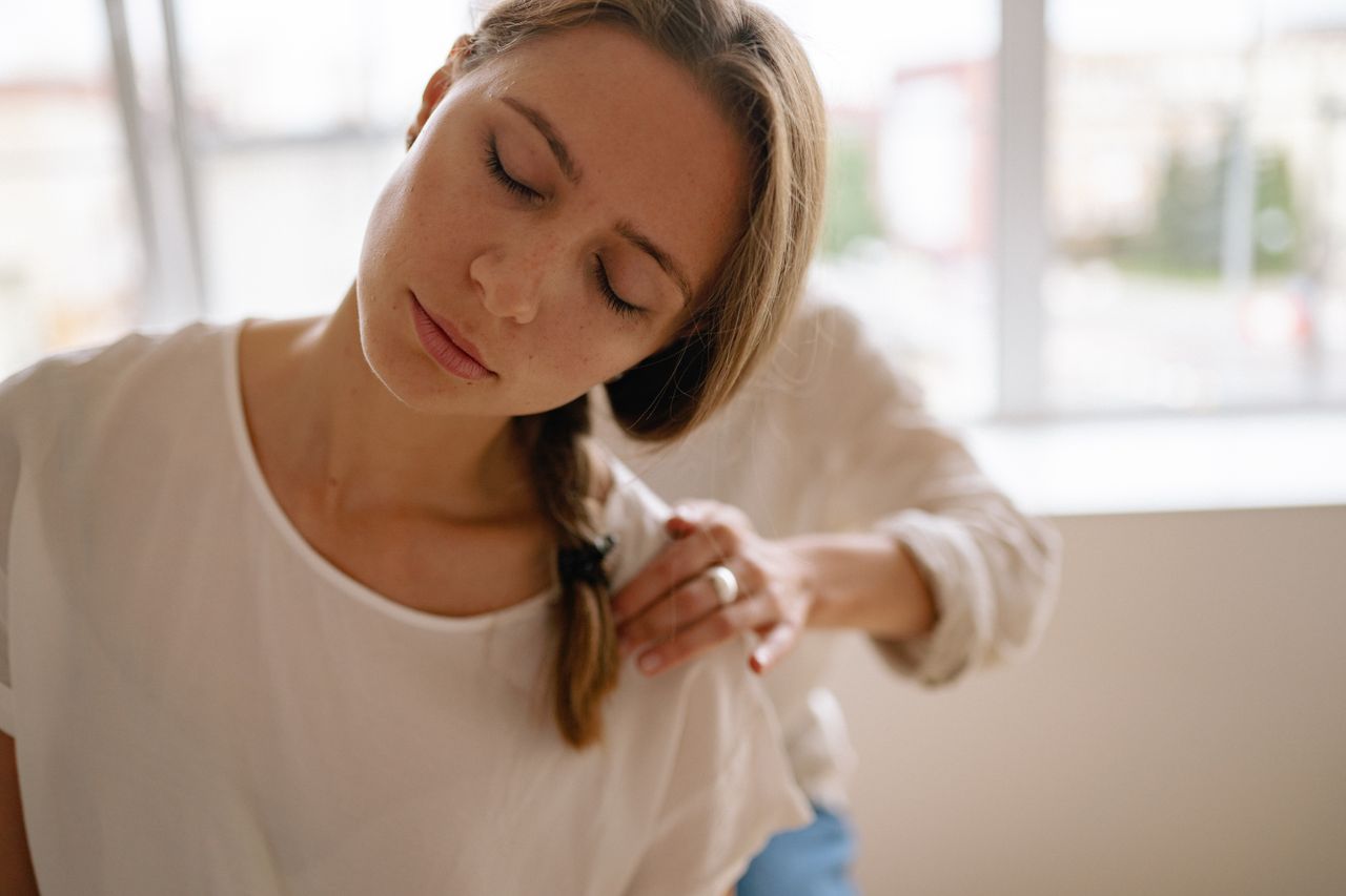 about-img A soothing massage session at a spa, highlighting relaxation and wellness indoors.